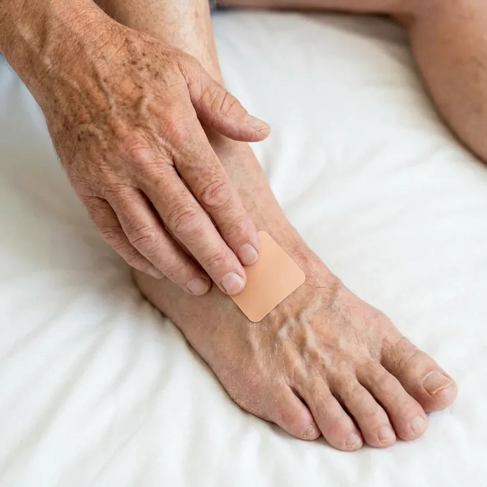 Patch being applied to the foot